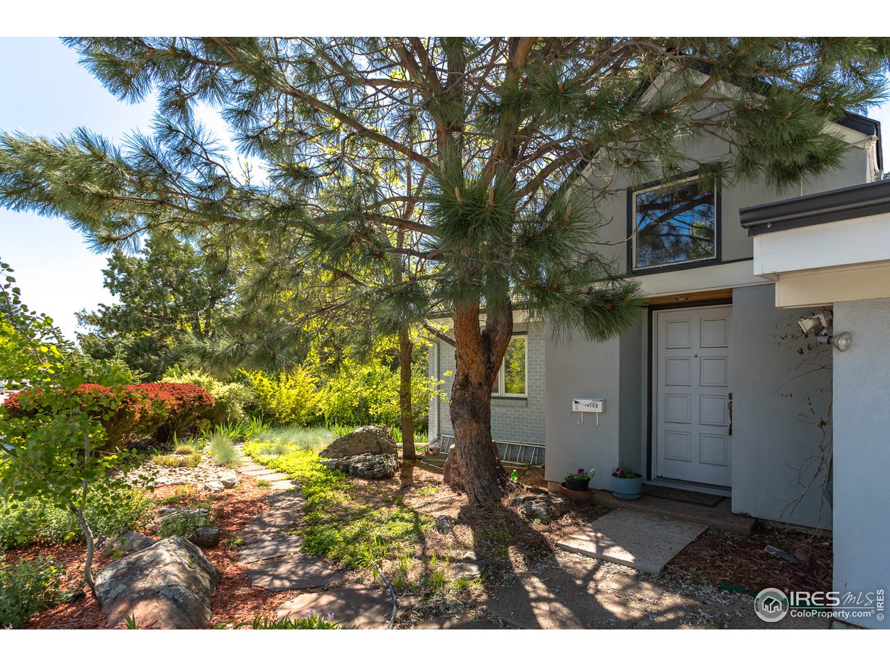 1450 High Street Boulder, CO 80304 - Photo 4 of 25 a view of a house with a yard
