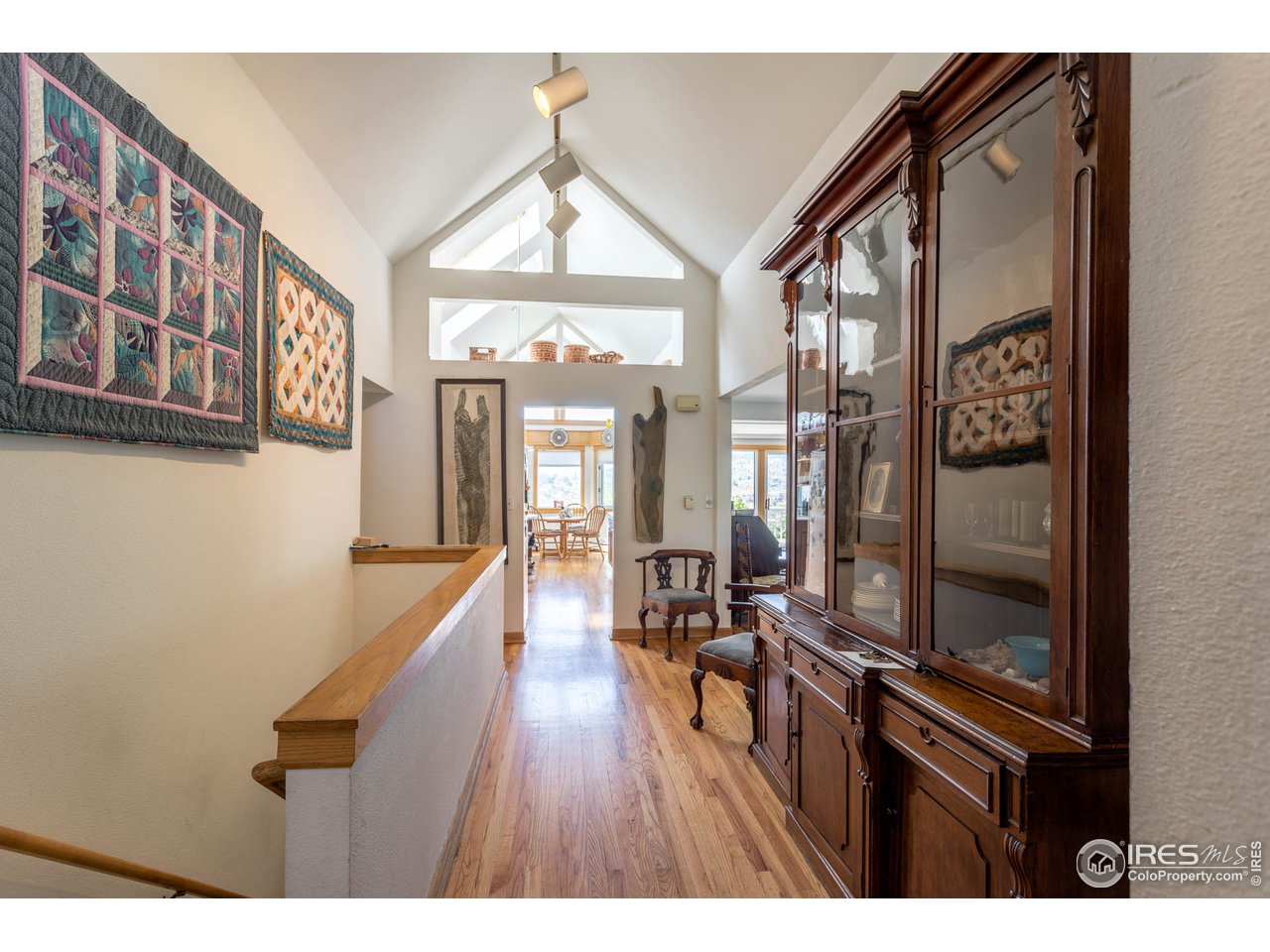 1450 High Street Boulder, CO 80304 - Photo 5 of 25 a hallway with wooden floor and furniture
