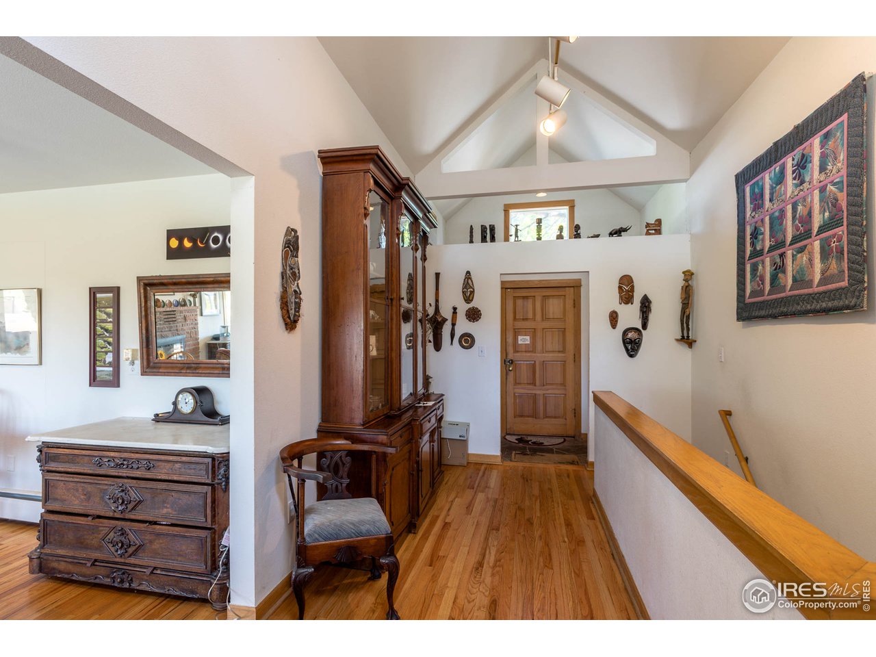 1450 High Street Boulder, CO 80304 - Photo 6 of 25 a hallway with a large closet and flat screen tv