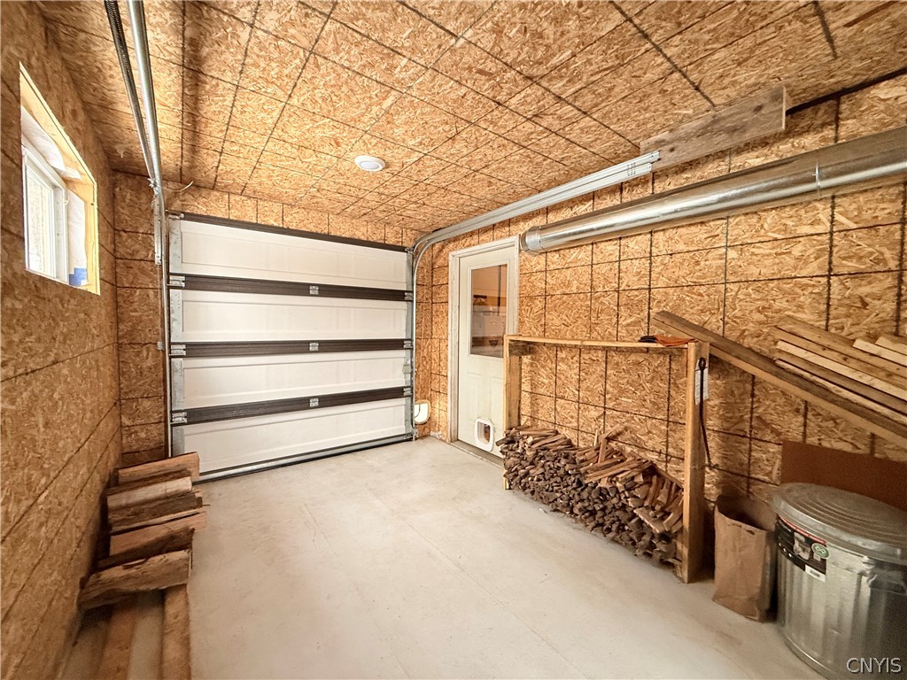 9689 Erie Canal Road Croghan, NY 13327 - Photo 49 of 50 Furnace room with overhead door big enough for ATV