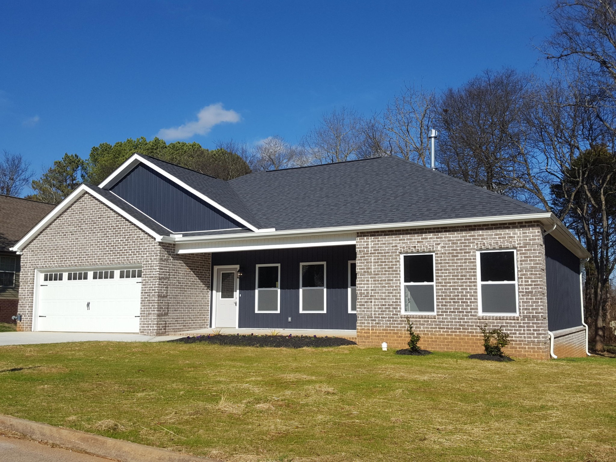 6074 Whisper Ridge Lane Corryton, TN 37721 - Photo 1 of 22 a front view of a house with a yard