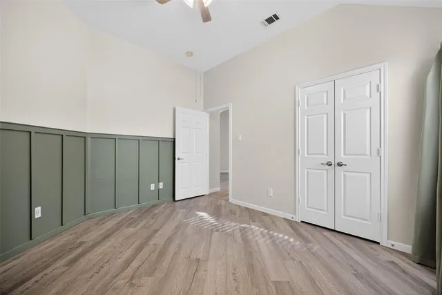 a view of hallway with wooden floor