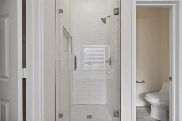 a bathroom with a granite countertop toilet