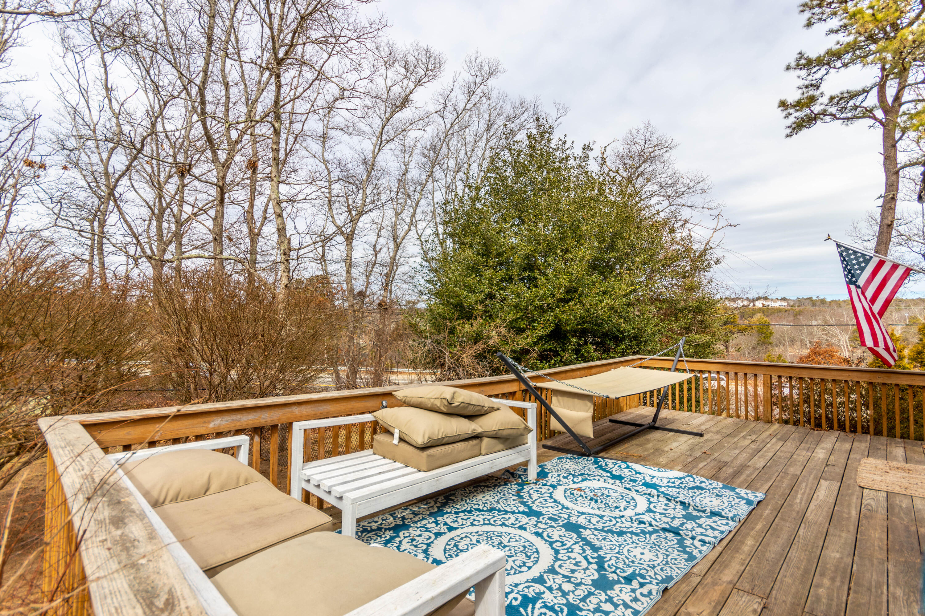 2 Long Boat Road Bourne, MA 02532 - Photo 14 of 30 a balcony with wooden floor and furniture