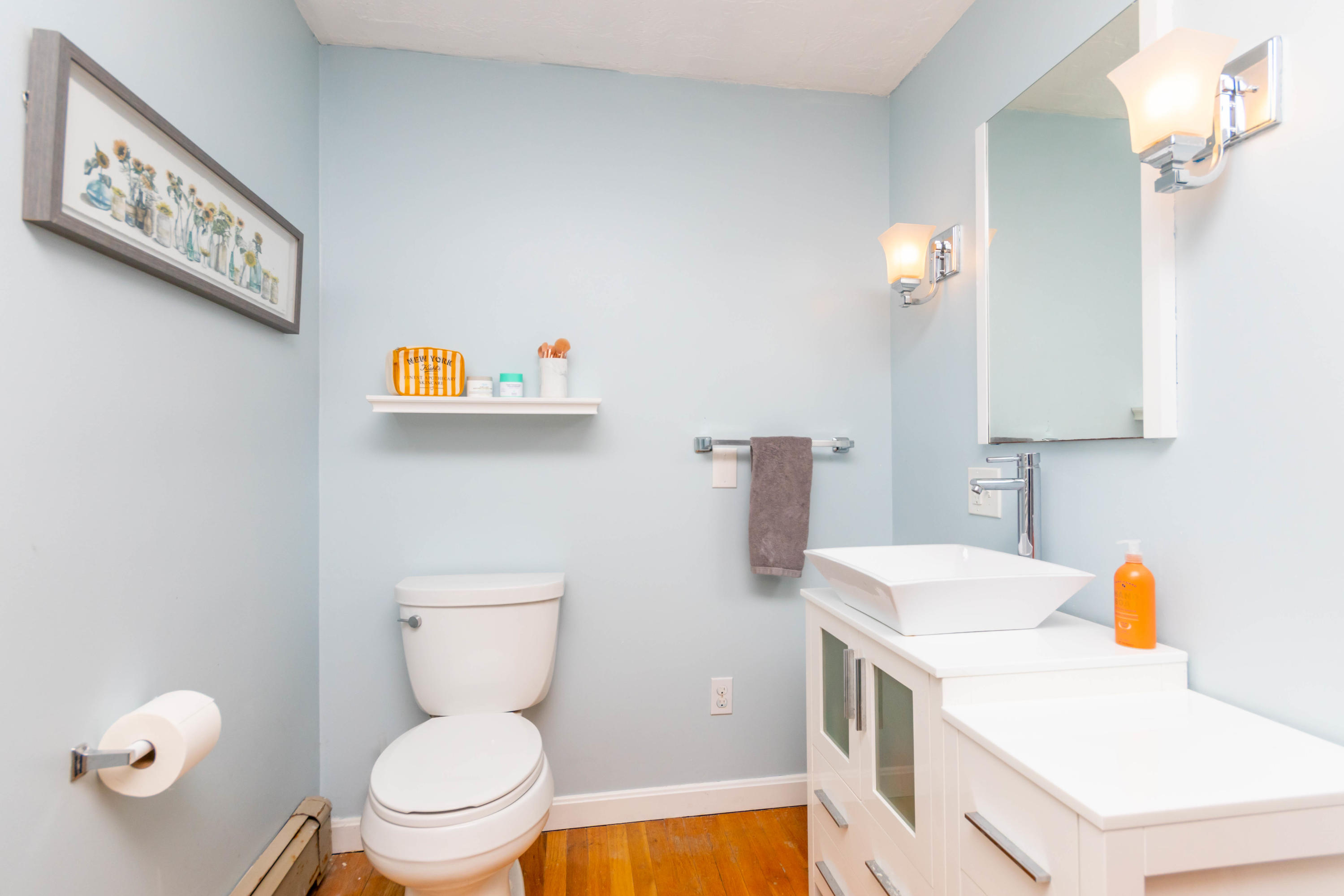 2 Long Boat Road Bourne, MA 02532 - Photo 16 of 30 a bathroom with a sink a toilet and a mirror