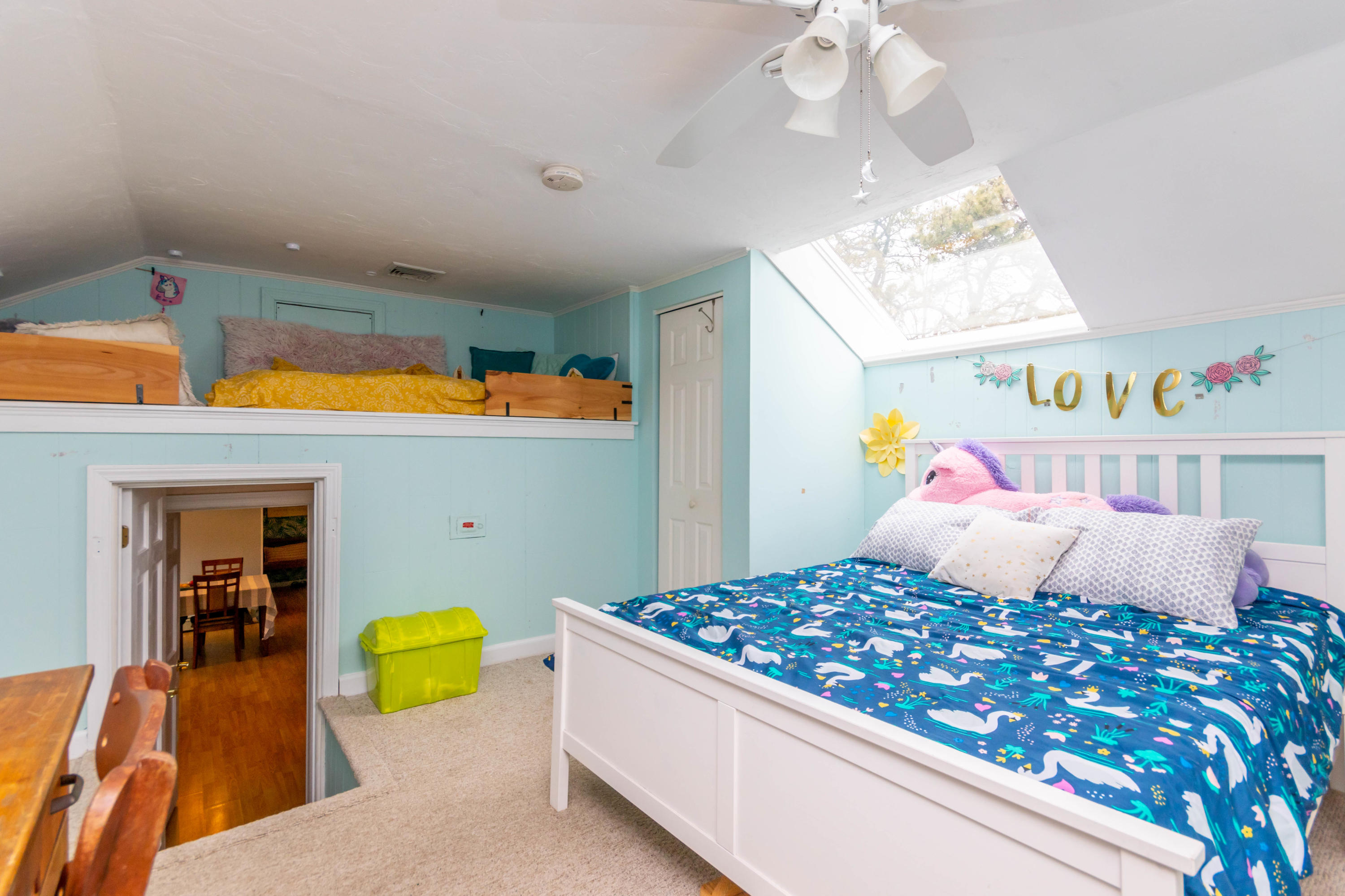 2 Long Boat Road Bourne, MA 02532 - Photo 20 of 30 a bedroom with a bed and a chandelier