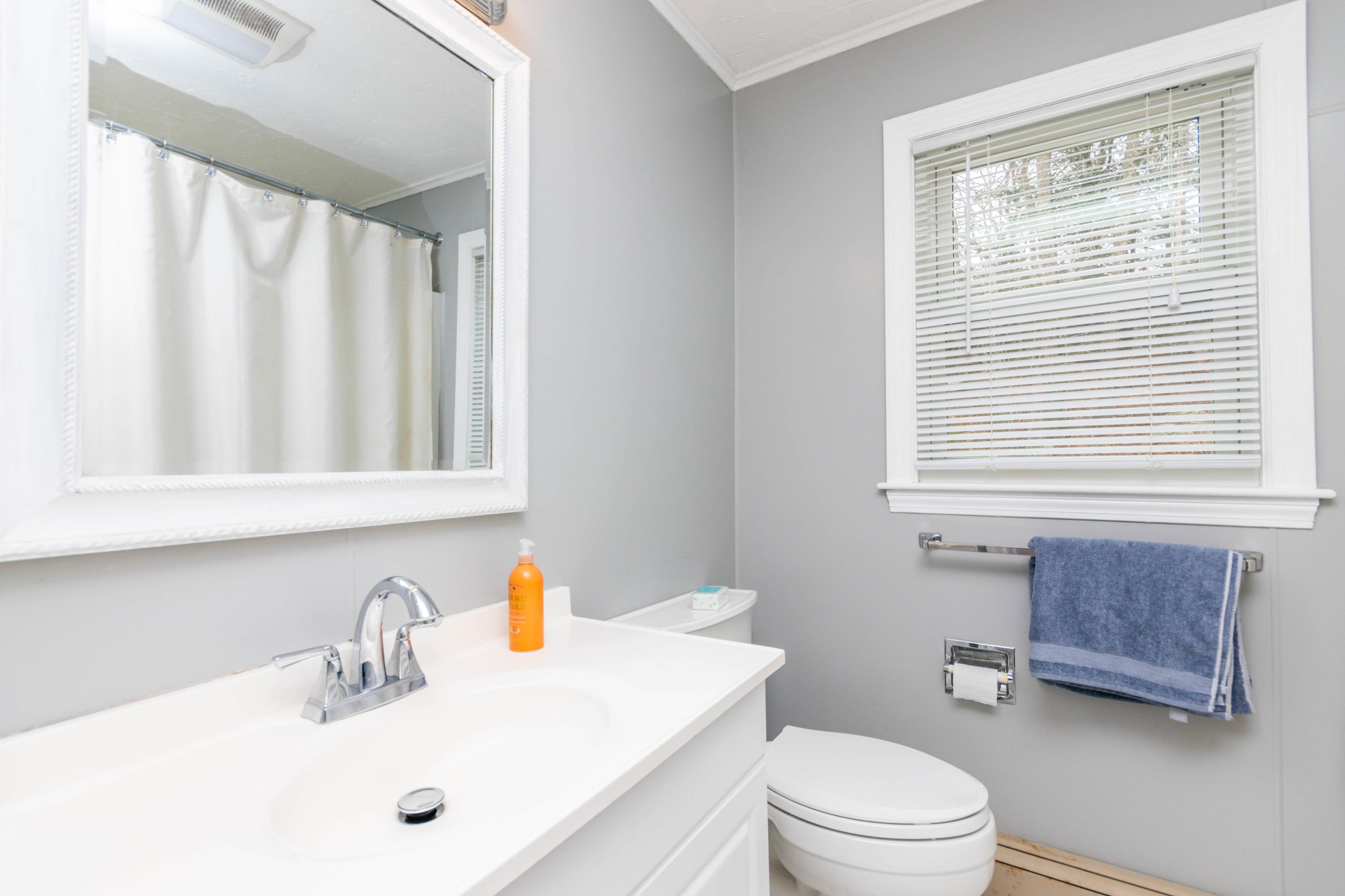2 Long Boat Road Bourne, MA 02532 - Photo 23 of 30 a bathroom with a sink a toilet and a window
