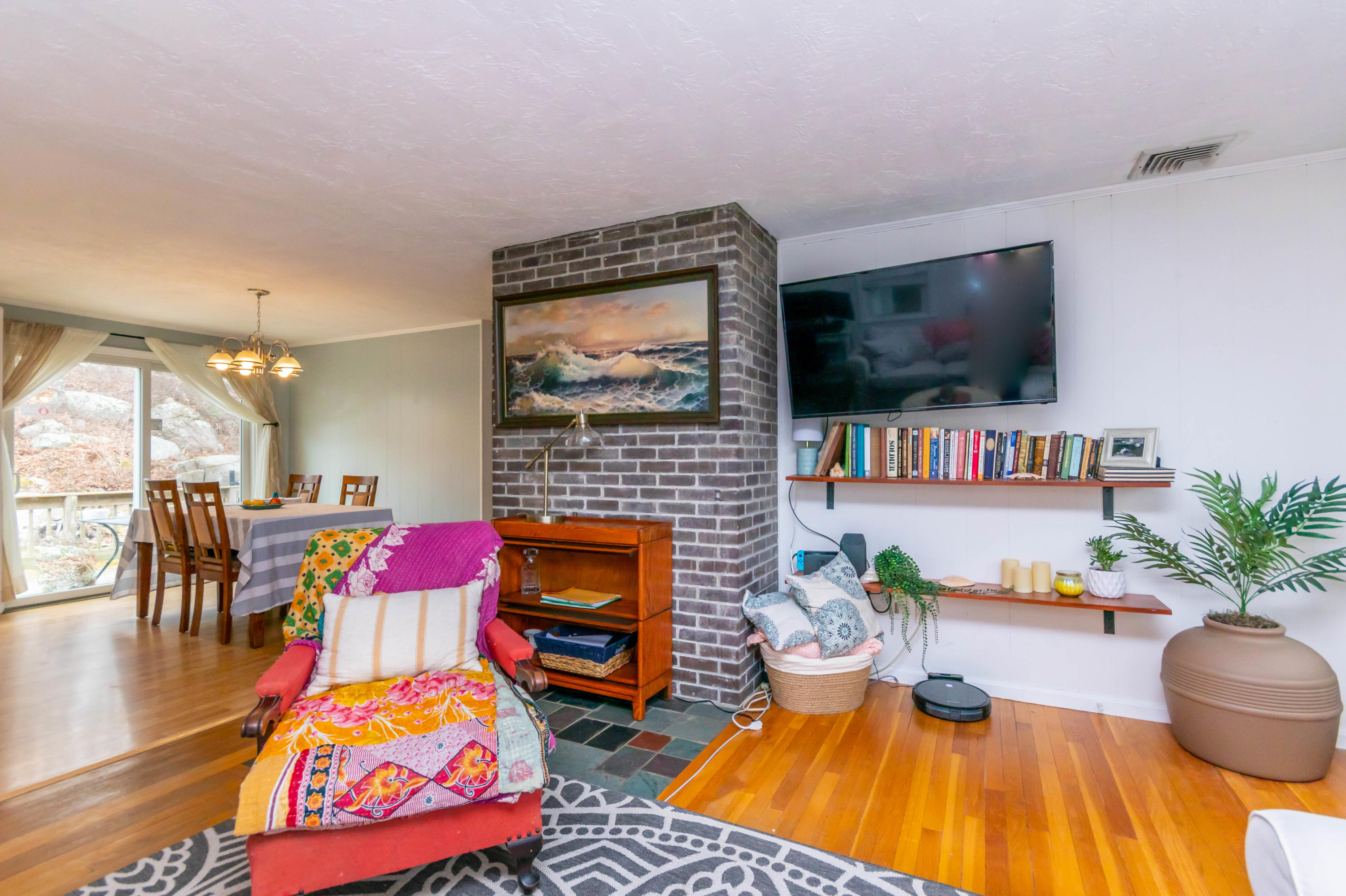 2 Long Boat Road Bourne, MA 02532 - Photo 5 of 30 a living room with furniture fireplace and flat screen tv