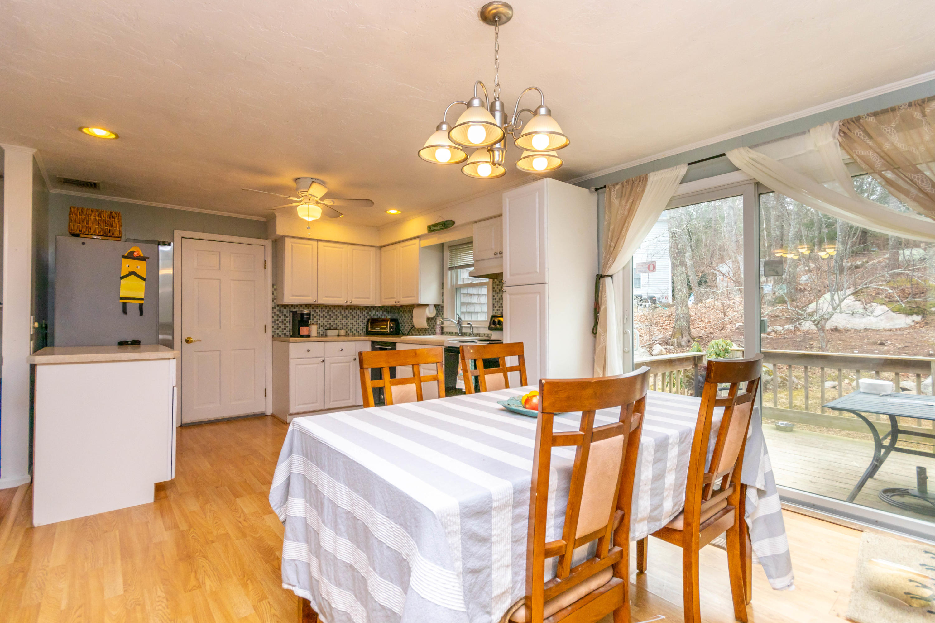 2 Long Boat Road Bourne, MA 02532 - Photo 9 of 30 a large kitchen with a table and chairs