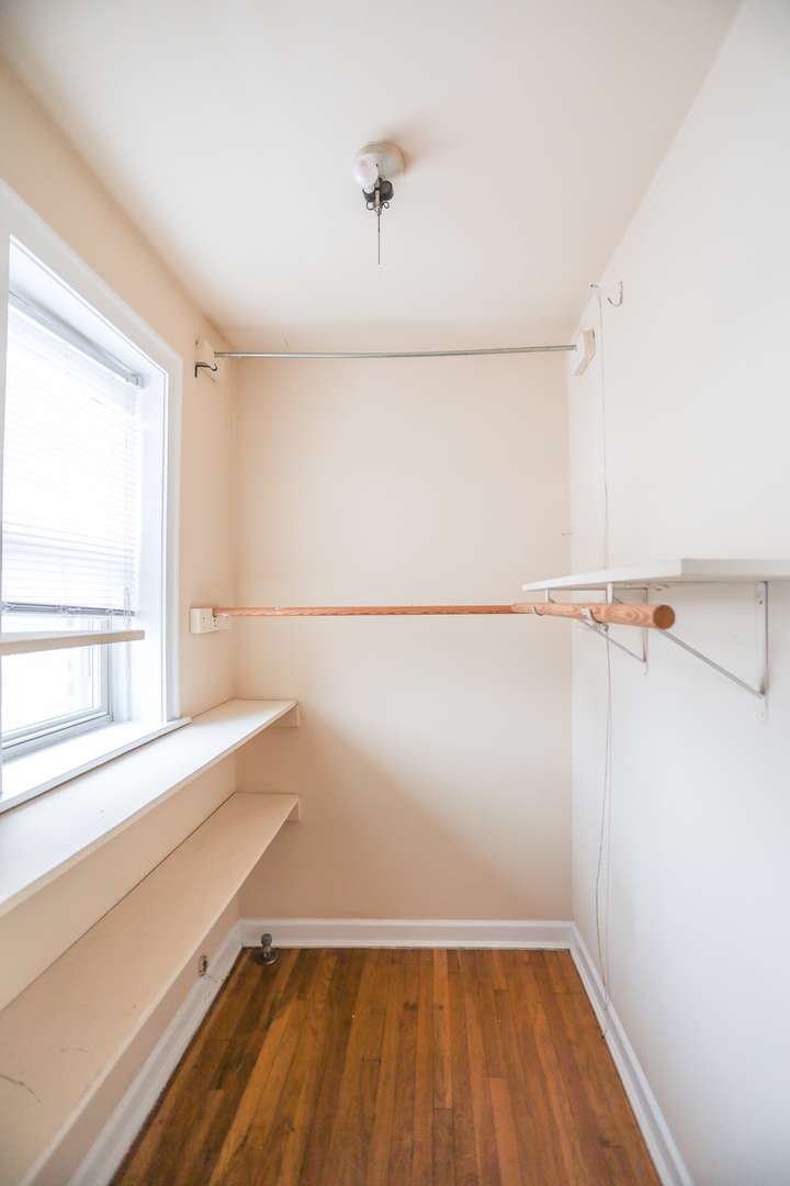 4724 West Addison Street, Unit 3A Chicago, IL 60641 - Photo 8 of 11 a view of a room with racks on the wall