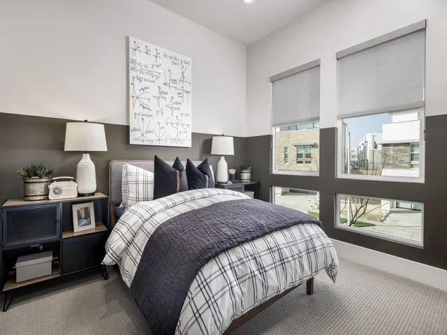 a bedroom with a bed and dresser