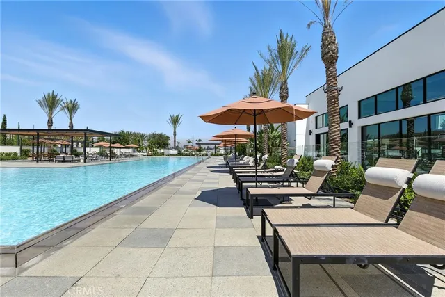 a view of a patio with chairs and a table