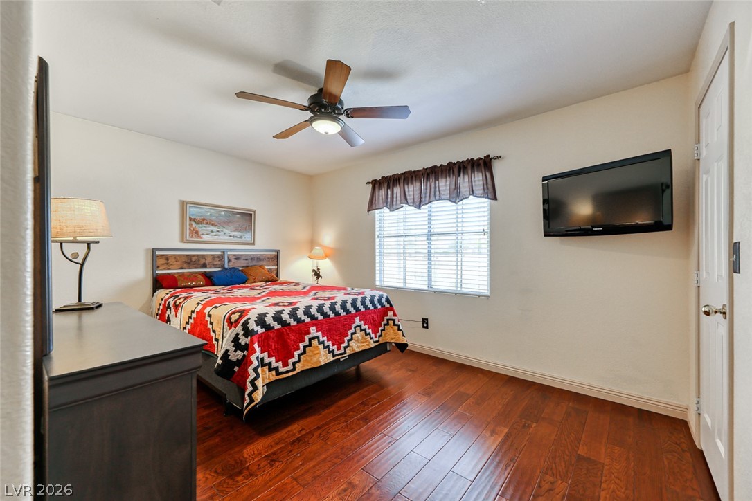 2001 Appaloosa Road Henderson, NV 89002 - Photo 36 of 44 This cozy bedroom features warm wood flooring and ample natural light.