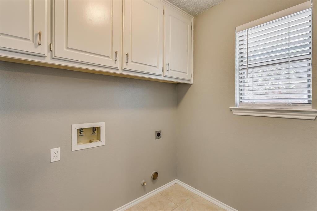 2407 Ridgevalley Drive McKinney, TX 75071 - Photo 14 of 28 a bathroom with white cabinets