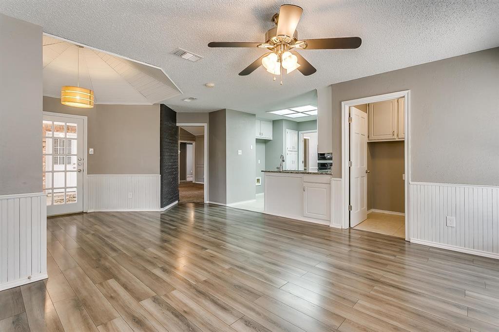 2407 Ridgevalley Drive McKinney, TX 75071 - Photo 18 of 28 a view of an empty room with window and wooden floor
