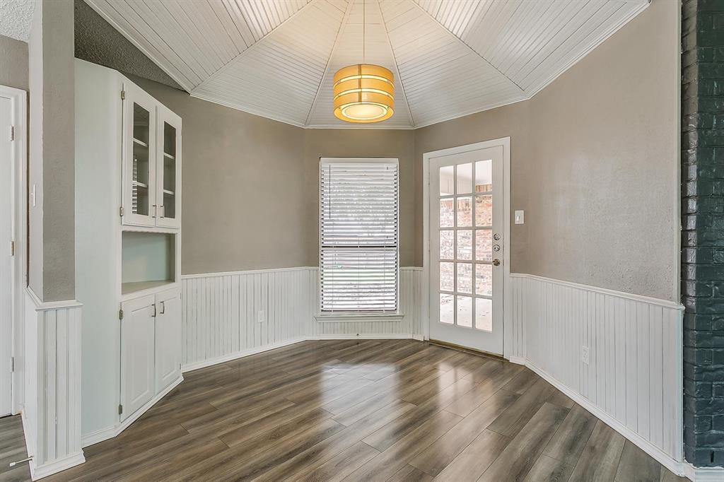 2407 Ridgevalley Drive McKinney, TX 75071 - Photo 19 of 28 an empty room with wooden floor and windows