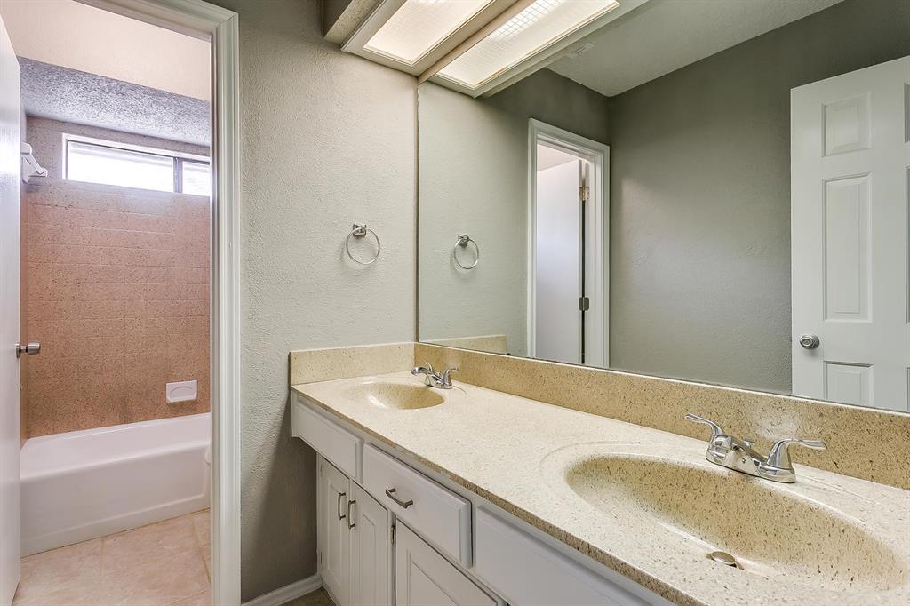 2407 Ridgevalley Drive McKinney, TX 75071 - Photo 22 of 28 a bathroom with a sink and a mirror
