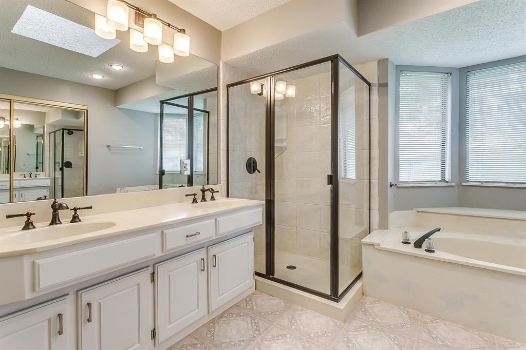 2407 Ridgevalley Drive McKinney, TX 75071 - Photo 26 of 28 a spacious bathroom with a double vanity sink mirror double and bathtub