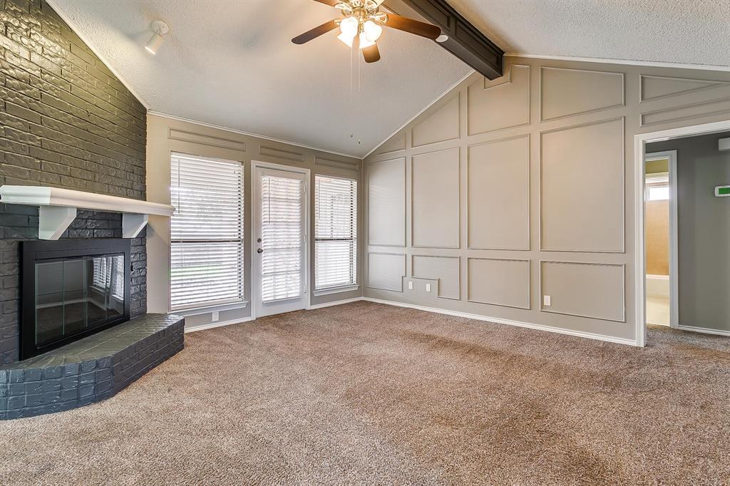 2407 Ridgevalley Drive McKinney, TX 75071 - Photo 7 of 28 a view of an empty room with a fireplace and a window