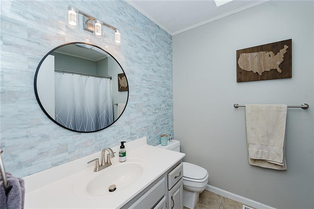 979 Barclay Road Indiana, PA 15701 - Photo 17 of 37 a bathroom with a toilet sink and mirror