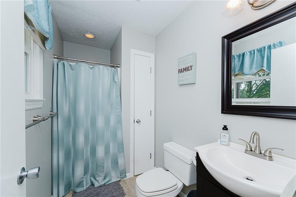 979 Barclay Road Indiana, PA 15701 - Photo 23 of 37 a bathroom with a toilet a sink and a mirror
