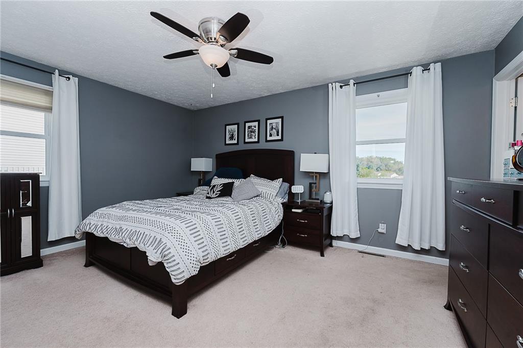 979 Barclay Road Indiana, PA 15701 - Photo 26 of 37 a bedroom with a bed and a chandelier
