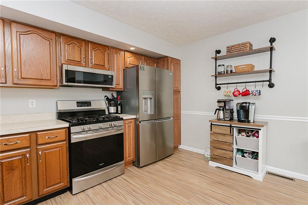 979 Barclay Road Indiana, PA 15701 - Photo 10 of 37 a kitchen with stainless steel appliances a stove microwave and refrigerator