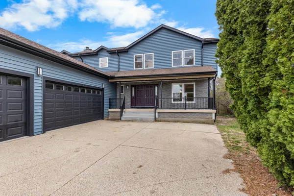 a house with white door of garage
