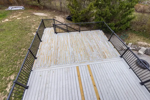 a view of balcony with wooden floor