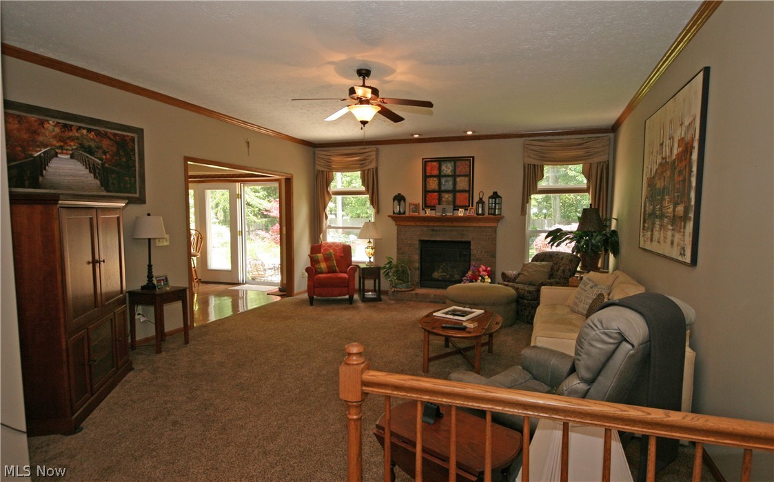 107 Timber Ridge Drive Elyria, OH 44035 - Photo 7 of 34 The great room with gas fireplace opens to the dinette area for easy entertaining
