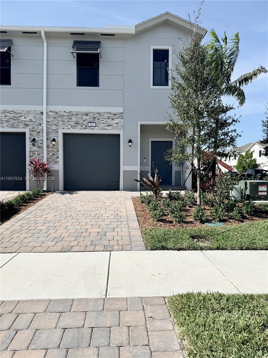 a front view of a house with yard