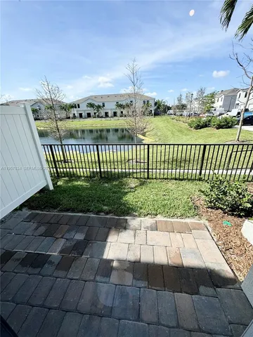 a view of a pathway with a garden