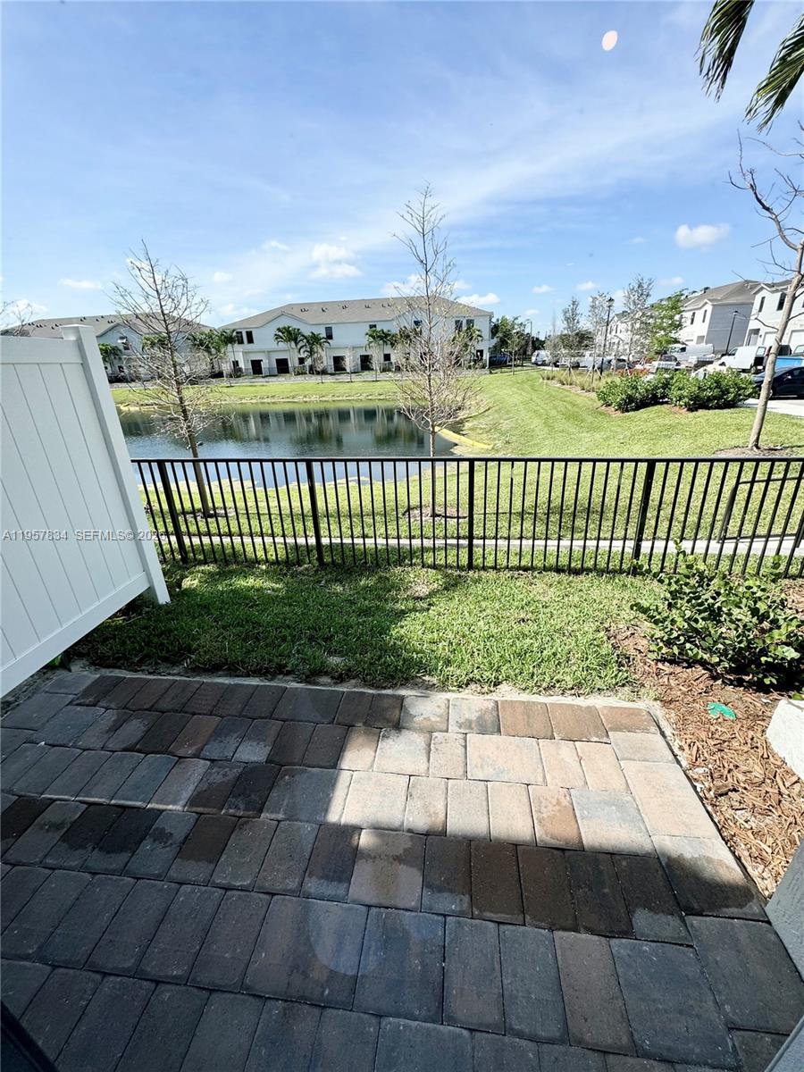 891 Northwest 3rd Street, Unit 891 Pompano Beach, FL 33060 - Photo 14 of 33 a view of a pathway with a garden