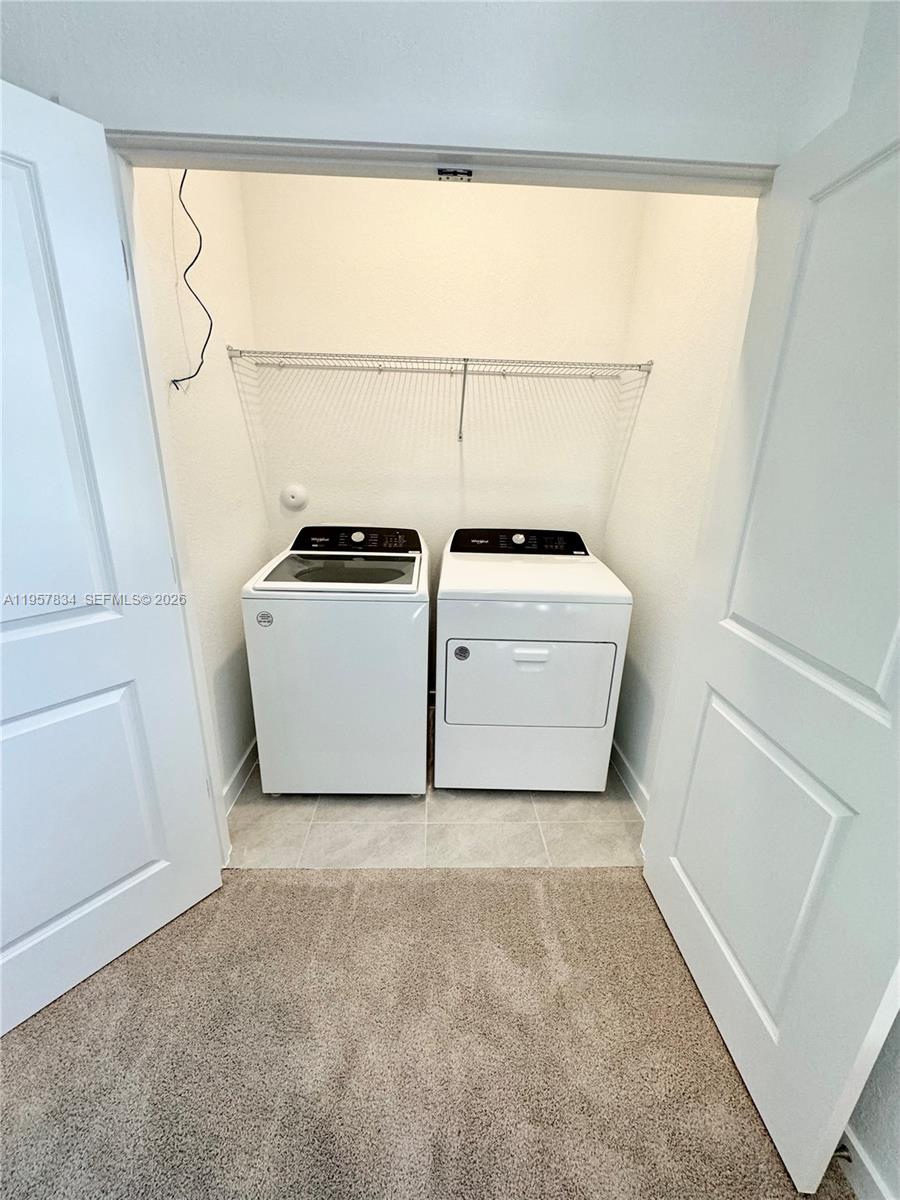 891 Northwest 3rd Street, Unit 891 Pompano Beach, FL 33060 - Photo 19 of 33 a utility room with dryer and washer