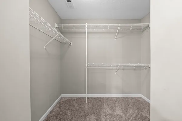 a view of an empty walk in closet