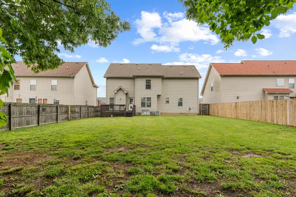 a view of a backyard of the house