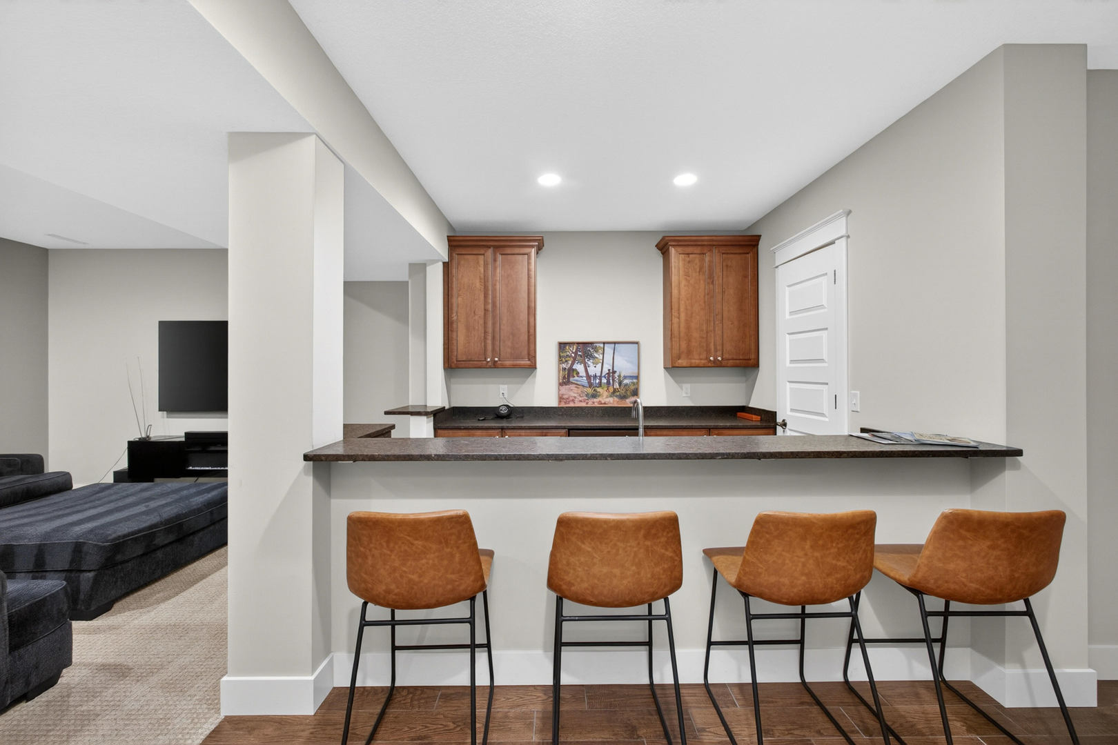 5700 Emily Road Bettendorf, IA 52722 - Photo 39 of 58 a kitchen with granite countertop chair and wooden cabinets