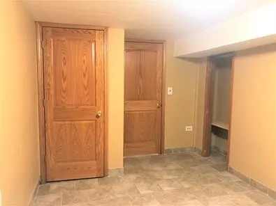 an empty room with closet area