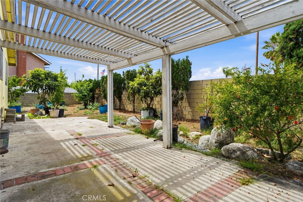 5131 Rotherham Circle Westminster, CA 92683 - Photo 37 of 50 a patio with table and chairs and potted plants
