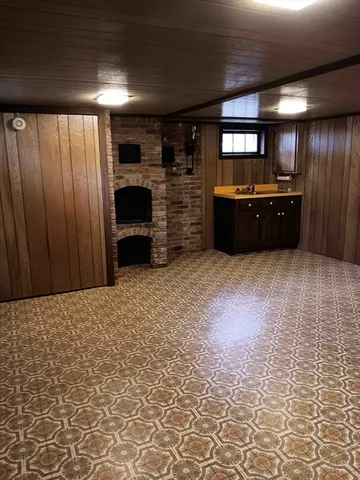 a view of an empty room with a fireplace