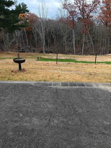 a view of a park with swings and slides