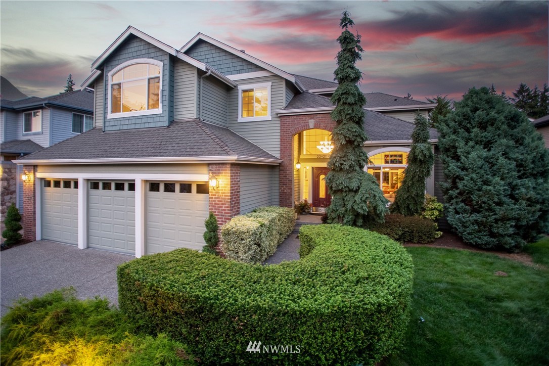 22421 6th Place West Bothell, WA 98021 - Photo 1 of 40 a front view of a house with a yard and garage