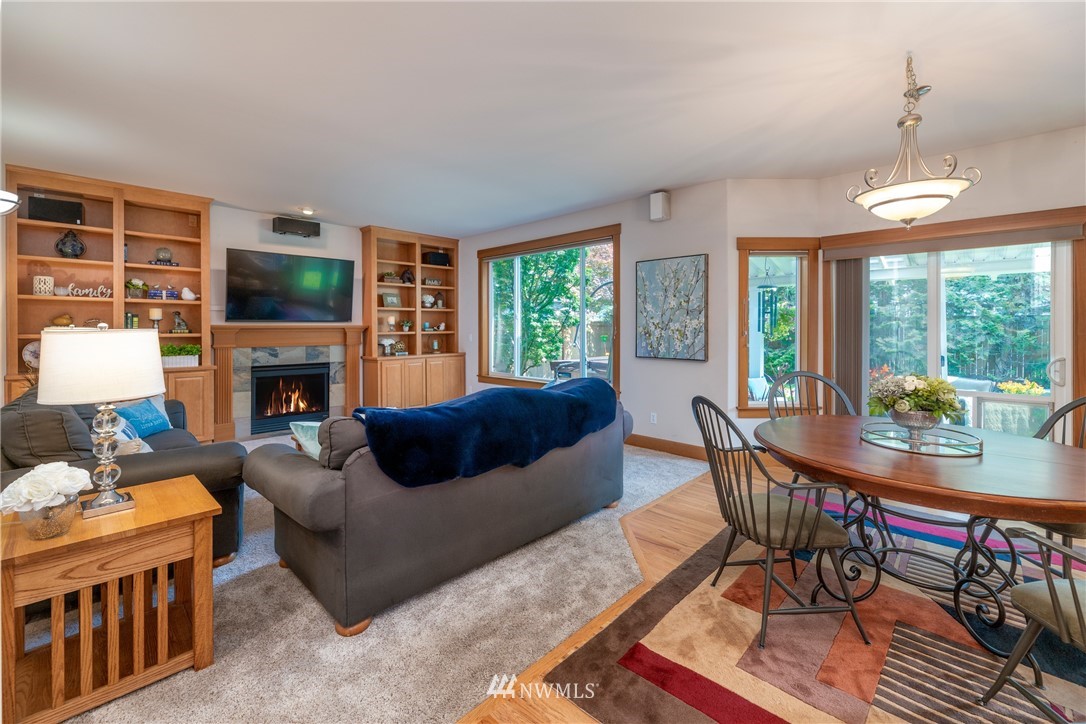 22421 6th Place West Bothell, WA 98021 - Photo 7 of 40 a living room with fireplace furniture and a flat screen tv