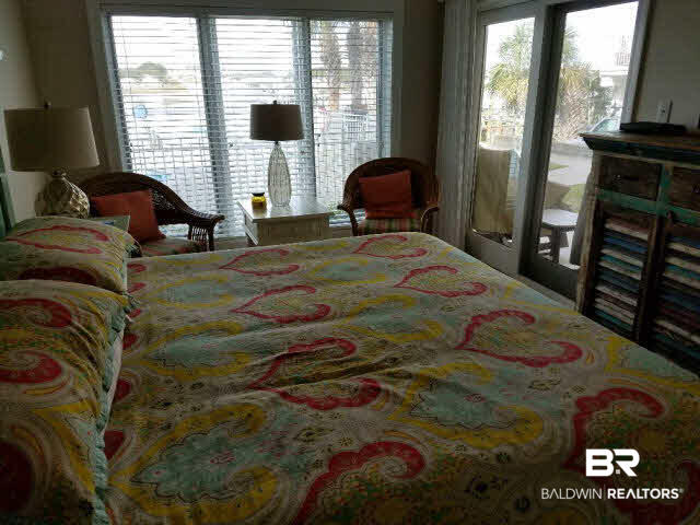 28875 Perdido Beach Boulevard, Unit 1A Orange Beach, AL 36561 - Photo 8 of 25 Large Master features great views of Ole river and Pool--walk out to Patio through sliding glass door. Bright and comfortable.