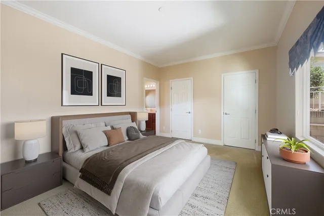 a bedroom with a bed and a couch