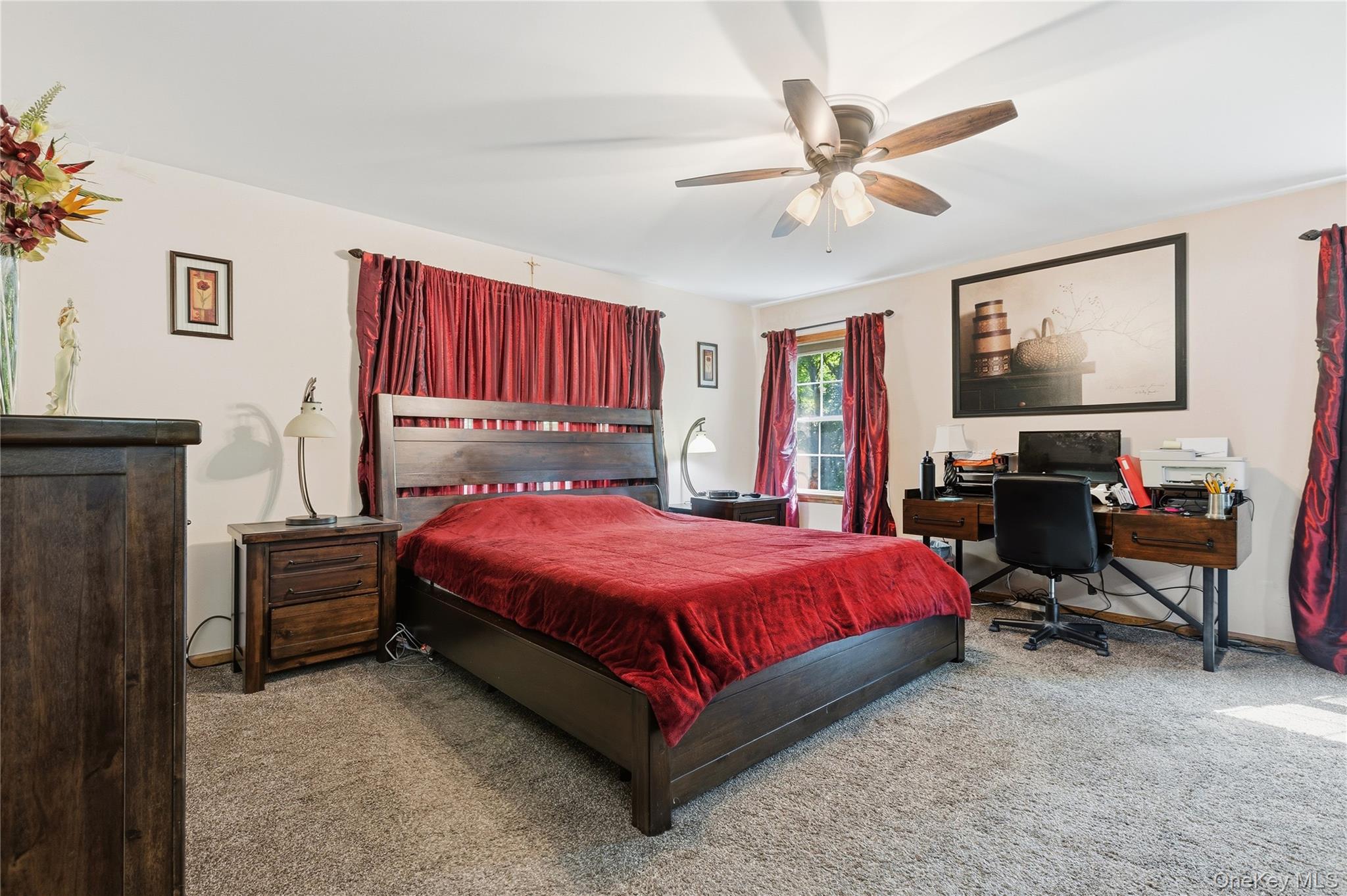 239-241 Fosler Road Highland, NY 12528 - Photo 6 of 42 Spacious room featuring neutral carpeting, a ceiling fan with light fixture, and natural light from a double window