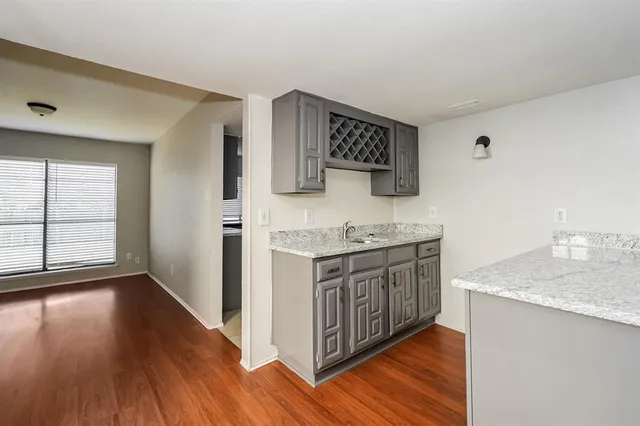 a bathroom with granite countertop a sink and a stove