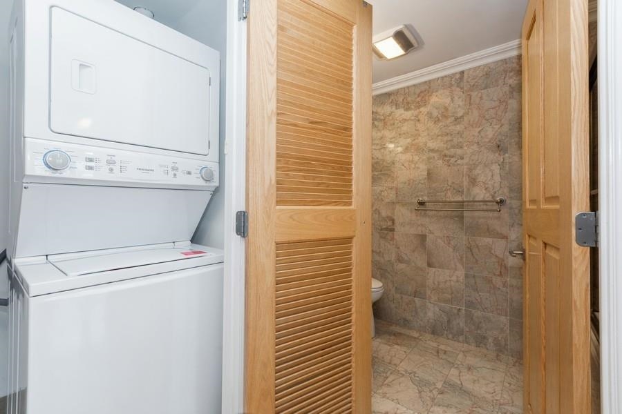 17 Meadow Road, Unit 407 Rutherford, NJ 07070 - Photo 16 of 21 a bathroom with a shower and toilet