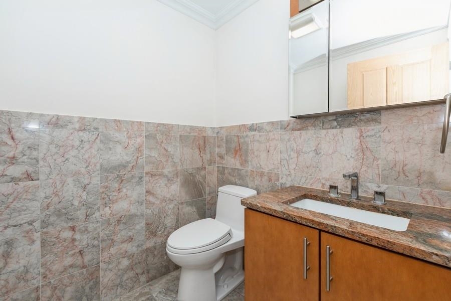 17 Meadow Road, Unit 407 Rutherford, NJ 07070 - Photo 9 of 21 a bathroom with a sink and a toilet