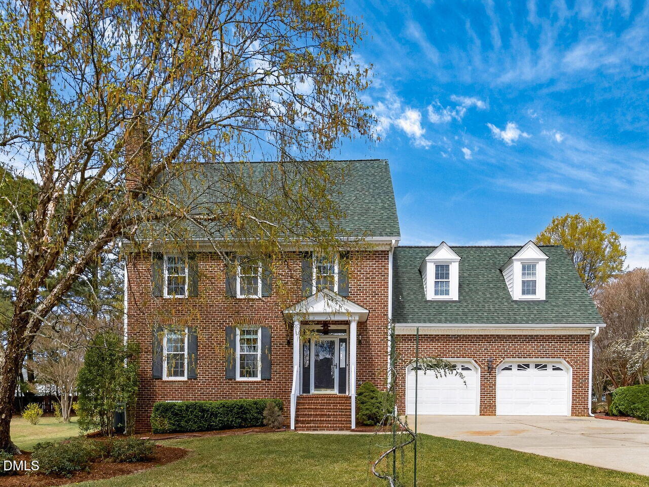 6104 Wolverhampton Drive Raleigh, NC 27603 - Photo 1 of 35 a front view of a house with garden